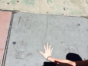 Lucky was inexplicably delighted to discover Nicholas Cage's handprints. Yes, Nick Cage. 